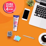 Clearasil acne cream on orange desk with laptop, coffee, and stationery – fast results in 4 hours